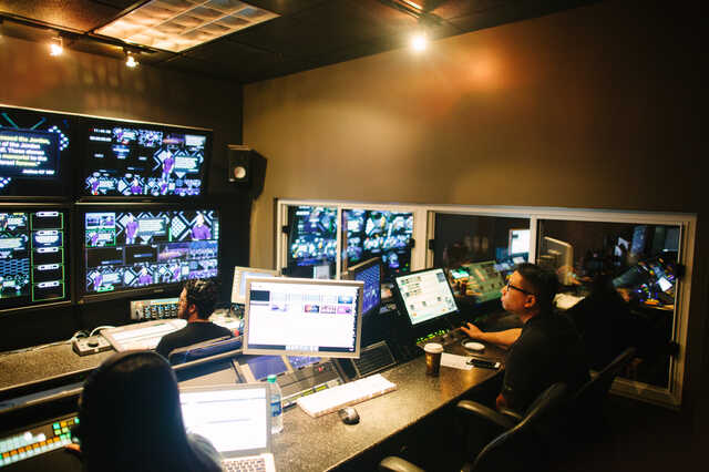 volunteers running sunday service inside the production room
