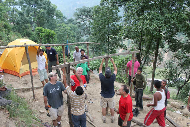 global x journey in haiti working on a construction project