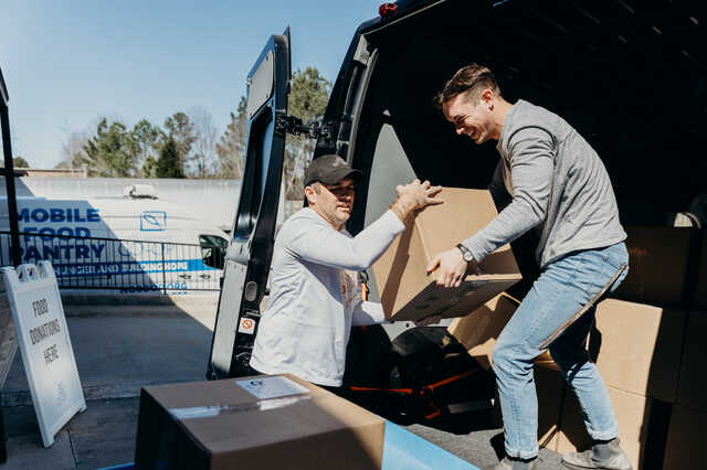 volunteers unloading food donations at the food bank